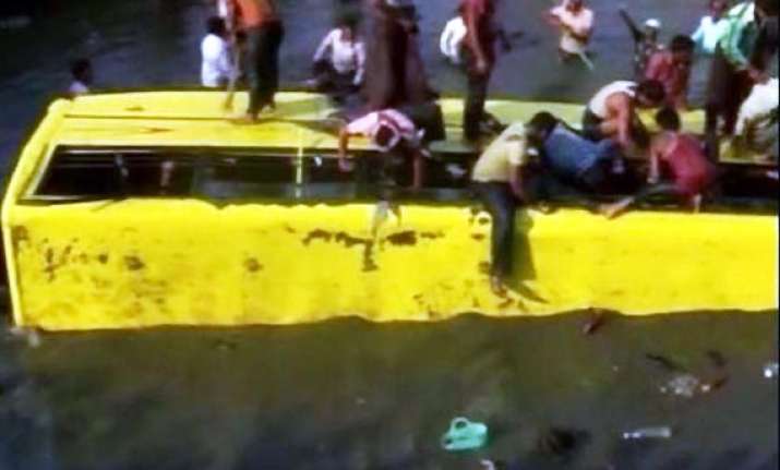 fourteen school children die as bus falls into canal in ap