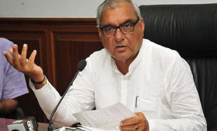 haryana cm hooda s relatives friends get prime industrial