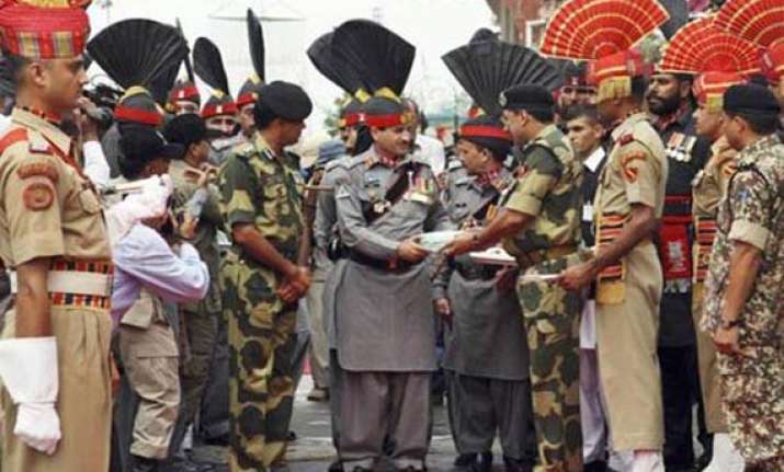 india pakistan border guards exchange sweets on eid