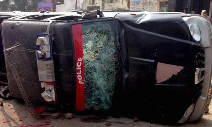 clashes in punjab over desecration of holy book leave 2 dead