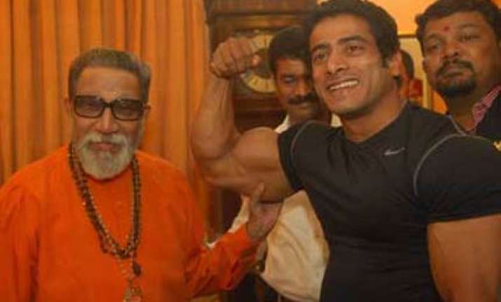 maratha bodybuilder flexes his muscles before bal thackeray