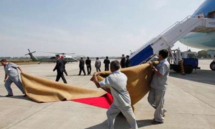 winds blow away red carpet laid out for obamas send off