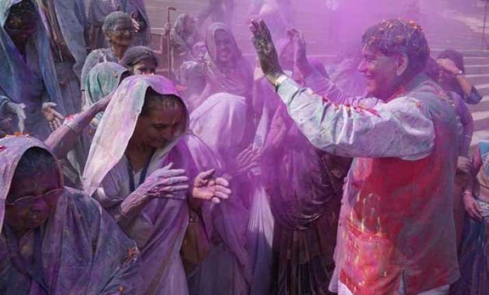 varanasi widows break tradition play holi on the banks of