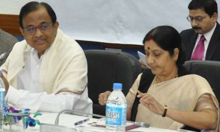 chidambaram sushma in a verbal duel on cvc