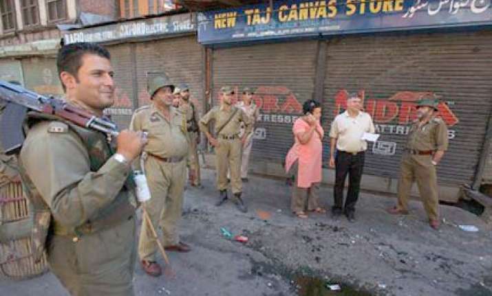 four injured in shopian curfew clamped in srinagar