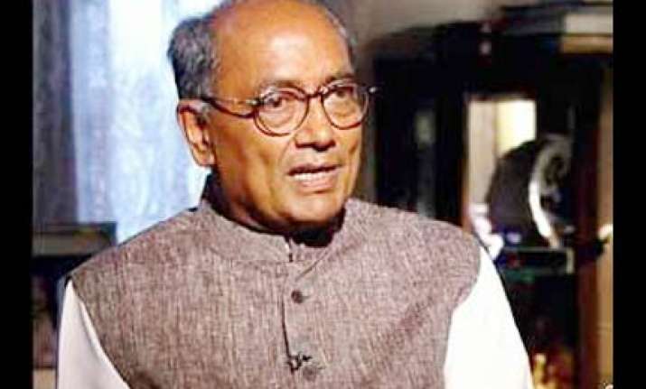 no need for kalmadi to resign says digvijay singh