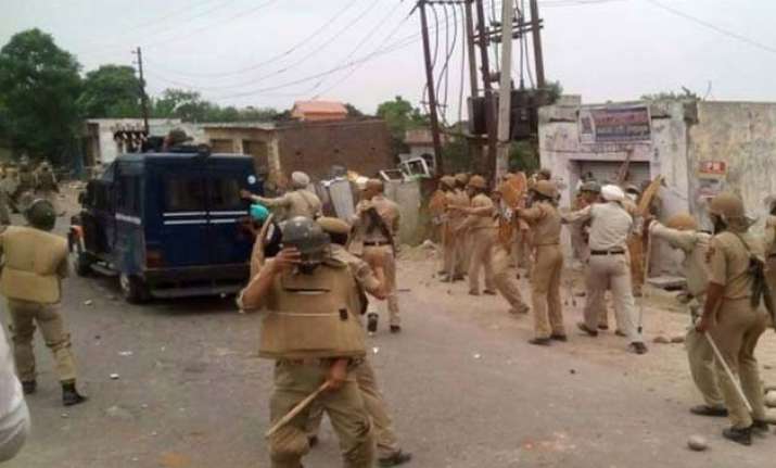 army stages flag march in samba 14 injured in clashes