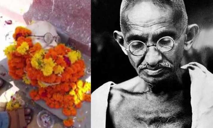shocking head of mahatma gandhi s statue falls off during