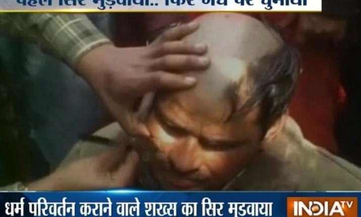 up man tonsured paraded on donkey for converting hindus to