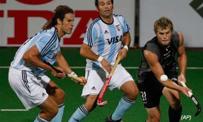 argentina register first win in hockey world cup