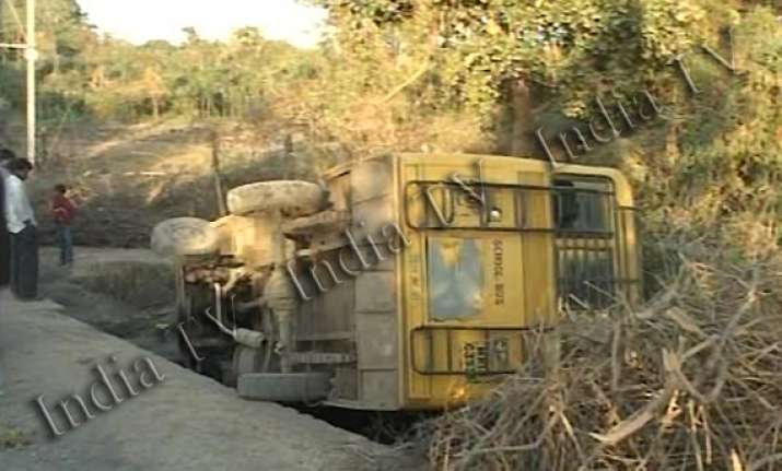 indore school bus with 60 children falls into drain