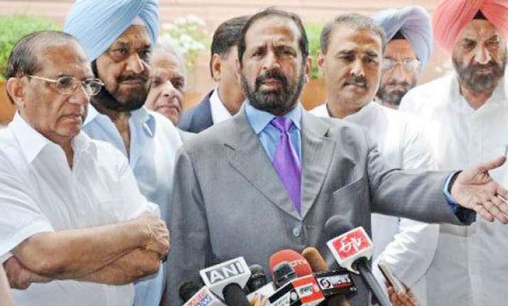 kalmadi sacked malhotra named ioa acting president
