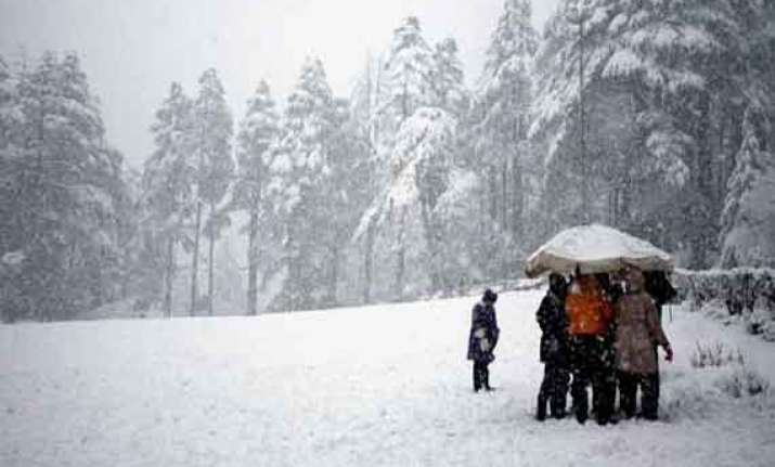 kashmir valley lashed by rains higher reaches receive snow