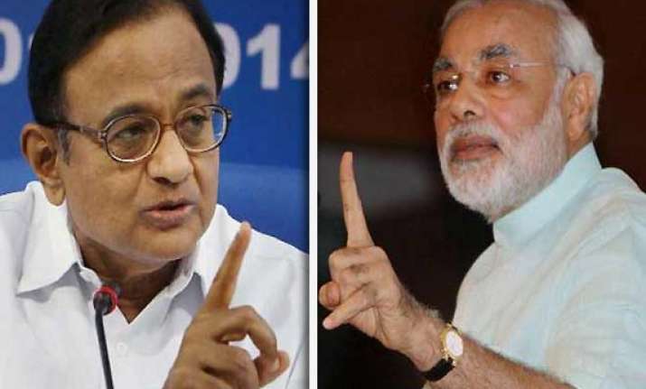 modi alleges distribution of watches with chidambaram s pics