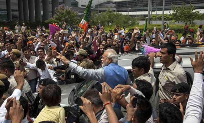 modi holds roadshow in delhi amidst cheering crowds