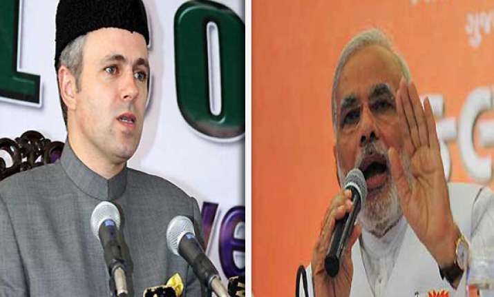 omar blames modi for inciting violence in assam