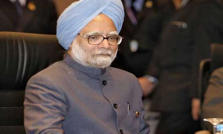 pm condemns assam violence promises steps to restore peace