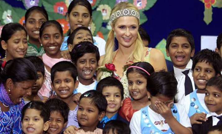 paris hilton dances with orphans prays at siddhivinayak