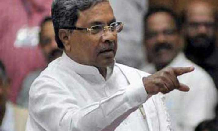 poll panel raps siddaramaiah for calling modi mass murderer
