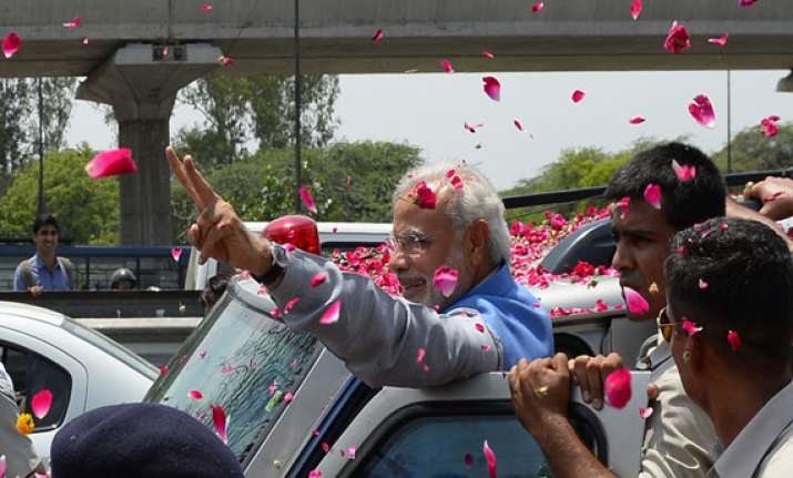 prime minister designate modi gets grand welcome at airport