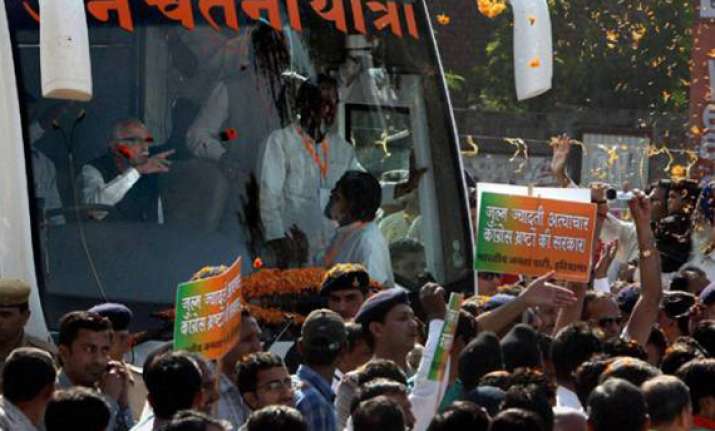 protesters hurl eggs at advani s rath wave black flags
