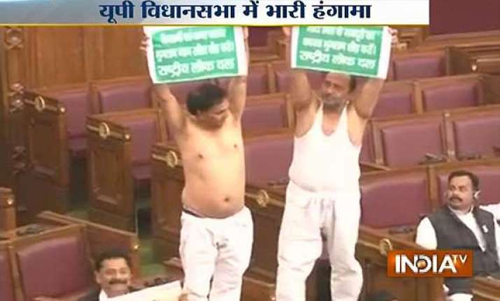 rld legislators take off their shirts in up assembly