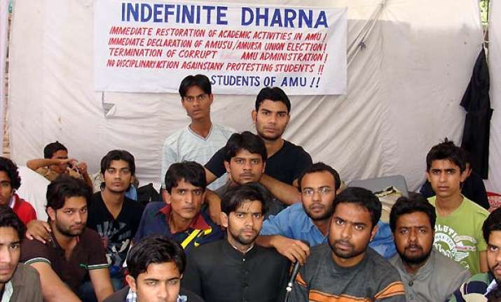 reopen amu remove v c demand teachers