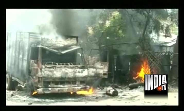 stoning arson in up town after customer s scuffle with bank
