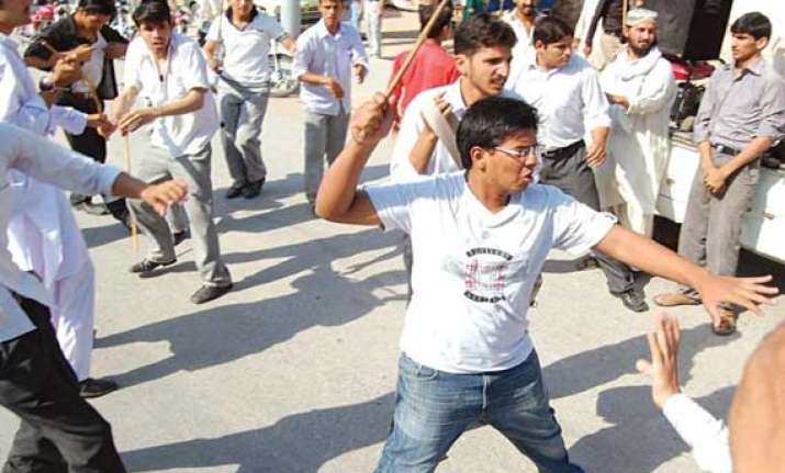 students block road protest against faulty inter results