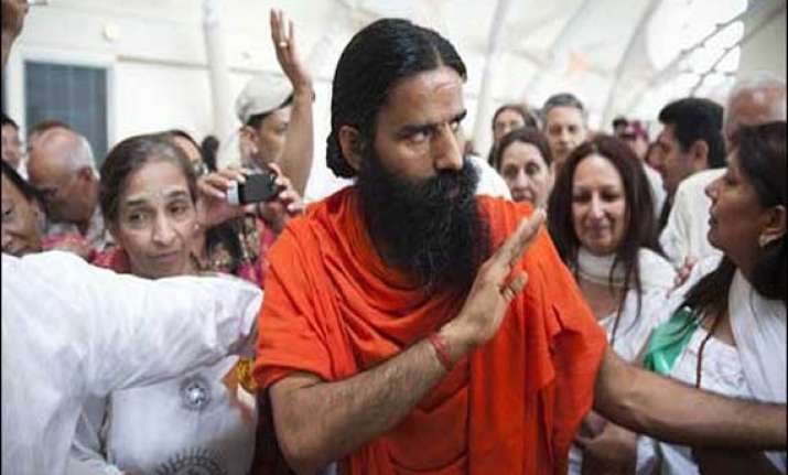 swami ramdev asks congress workers to remain humble