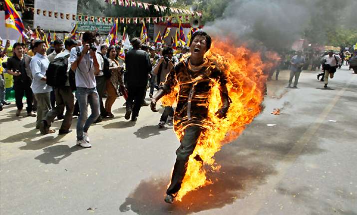 tibetan sets himself on fire in delhi hospitalized with