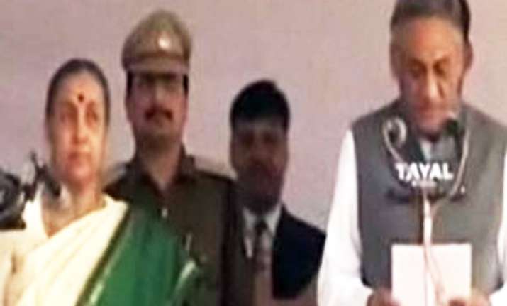 vijay bahuguna sworn in as uttarakhand cm amid revolt in