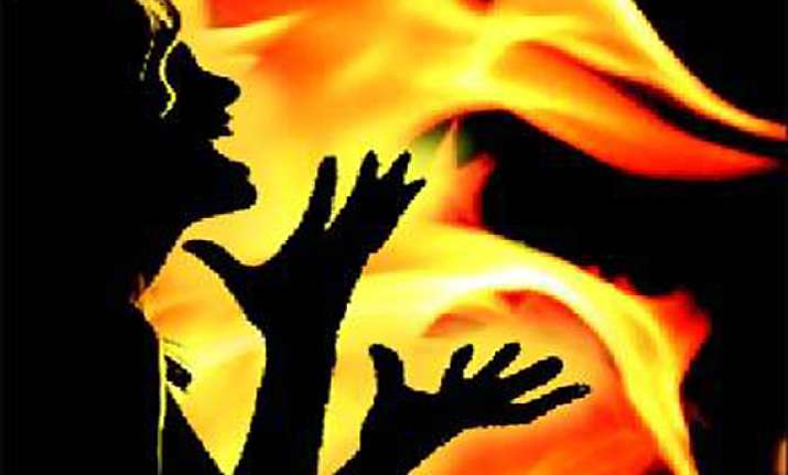 woman set ablaze by husband for opposing extra marital