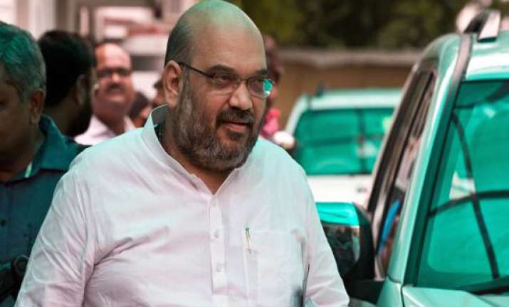 aap demands action against amit shah