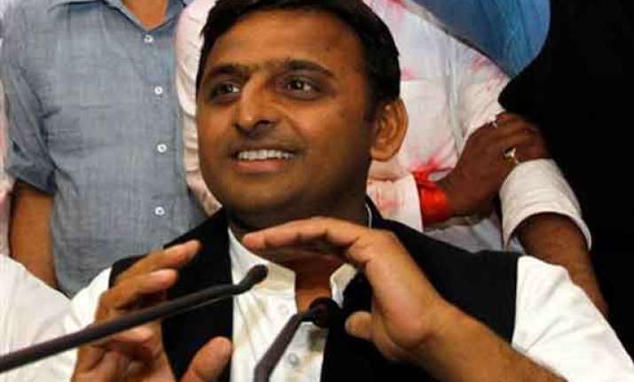 akhilesh defends vadra calls modi a model of dividing india