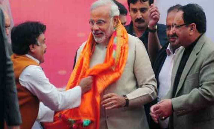 bjp mlas felicitate modi as exit polls predict nda victory