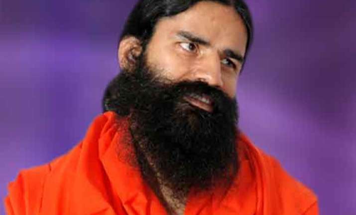 congress demands arrest of ramdev over honeymoon remark