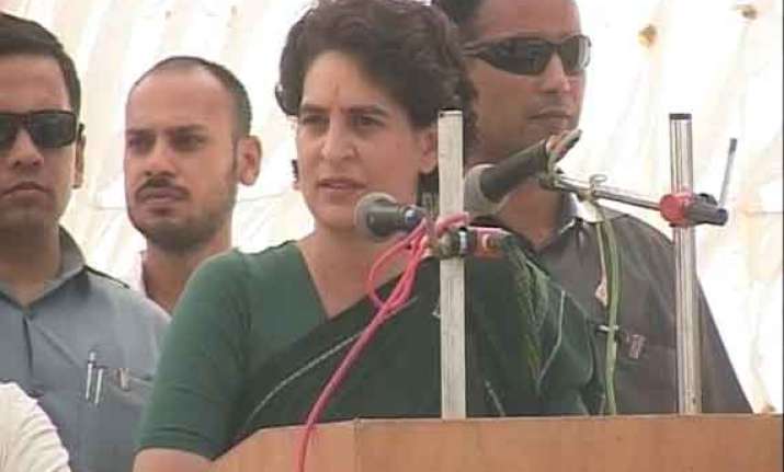 in pics braving an odd weather priyanka in favour of rahul