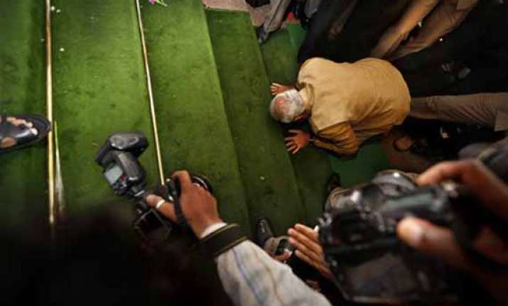 in pics narendra modi bows on parliament steps