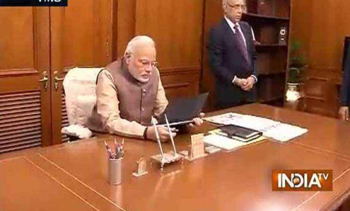 in pics narendra modi takes charge as pm