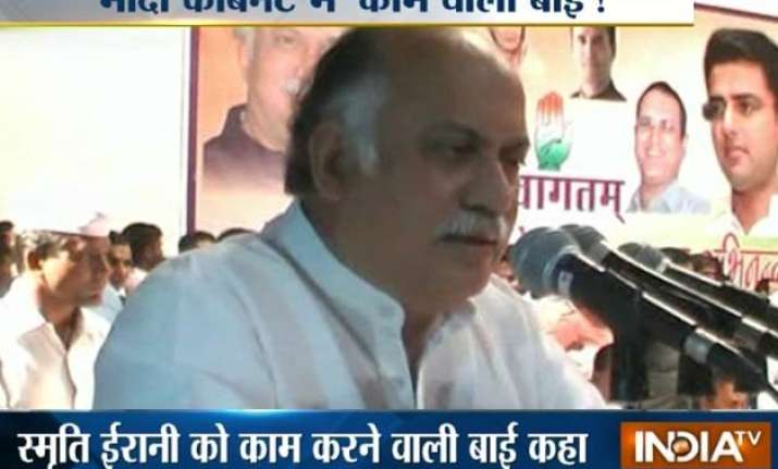 congress leader gurudas kamat calls smriti irani kaamwali
