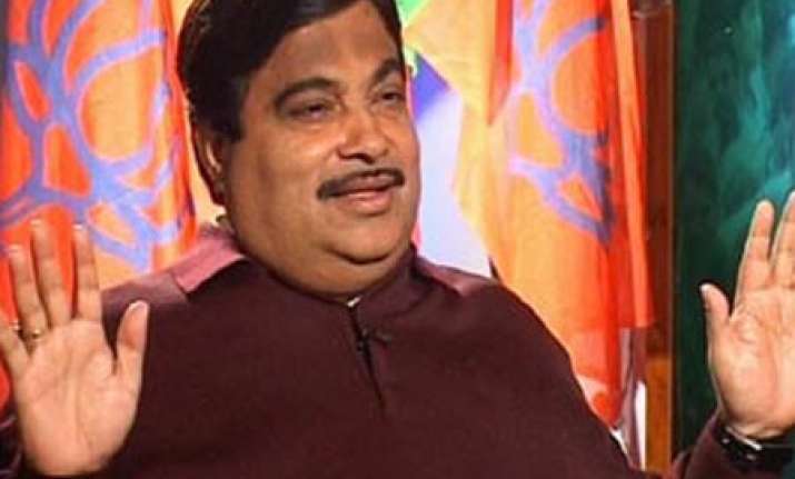 congress alleges gadkari of holding benami flat in adarsh