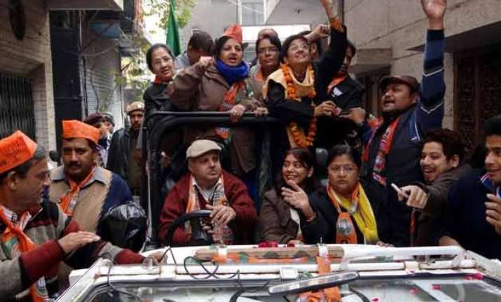 delhi polls kiran bedi campaigns in south delhi tweets