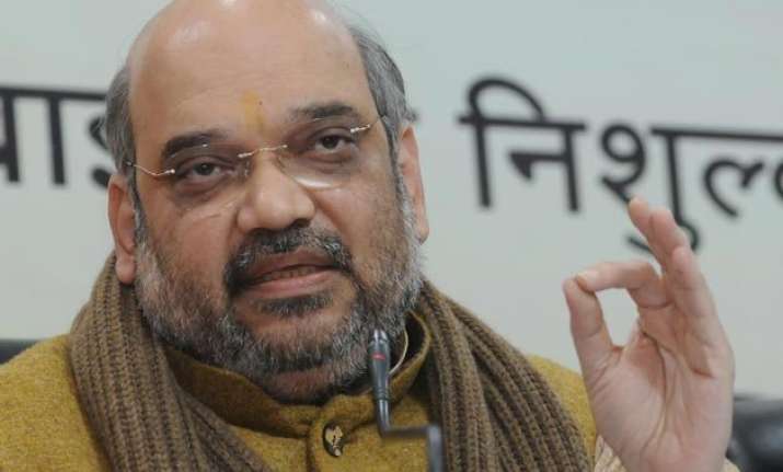 amit shah attacks manmohan over graft under his watch
