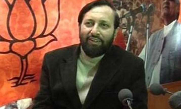 bjp trains its guns on pm over scams