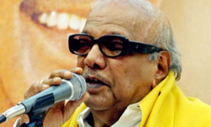 karunanidhi backs raja rules out resignation