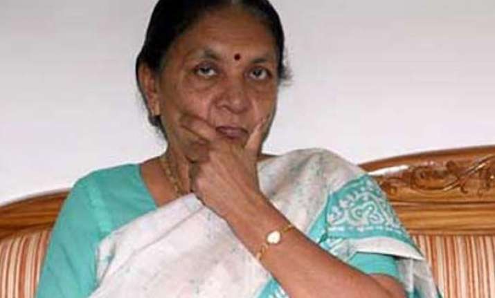 land controversy aap demands guj cm s resignation