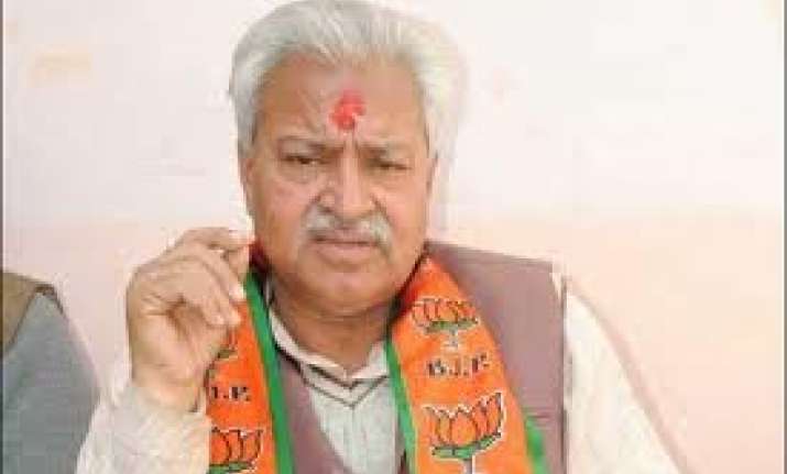 bjp dares azam khan to ban rss in up