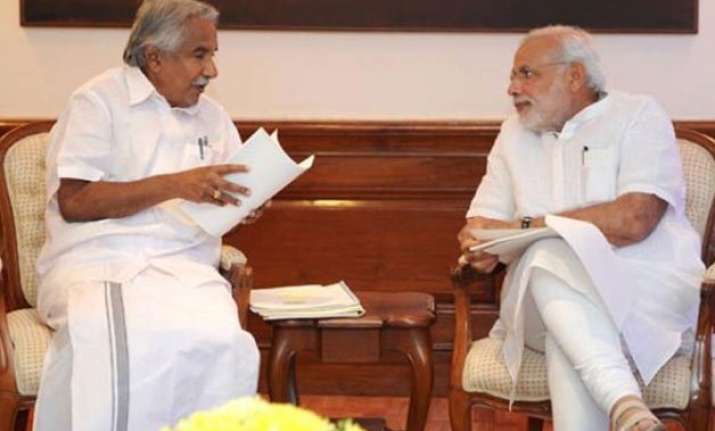 cm oommen chandy slams raid at kerala house writes to pm