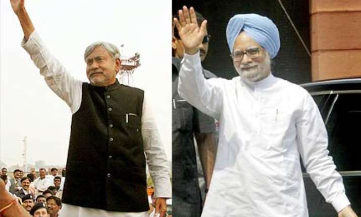 manmohan makes veiled attack on nitish